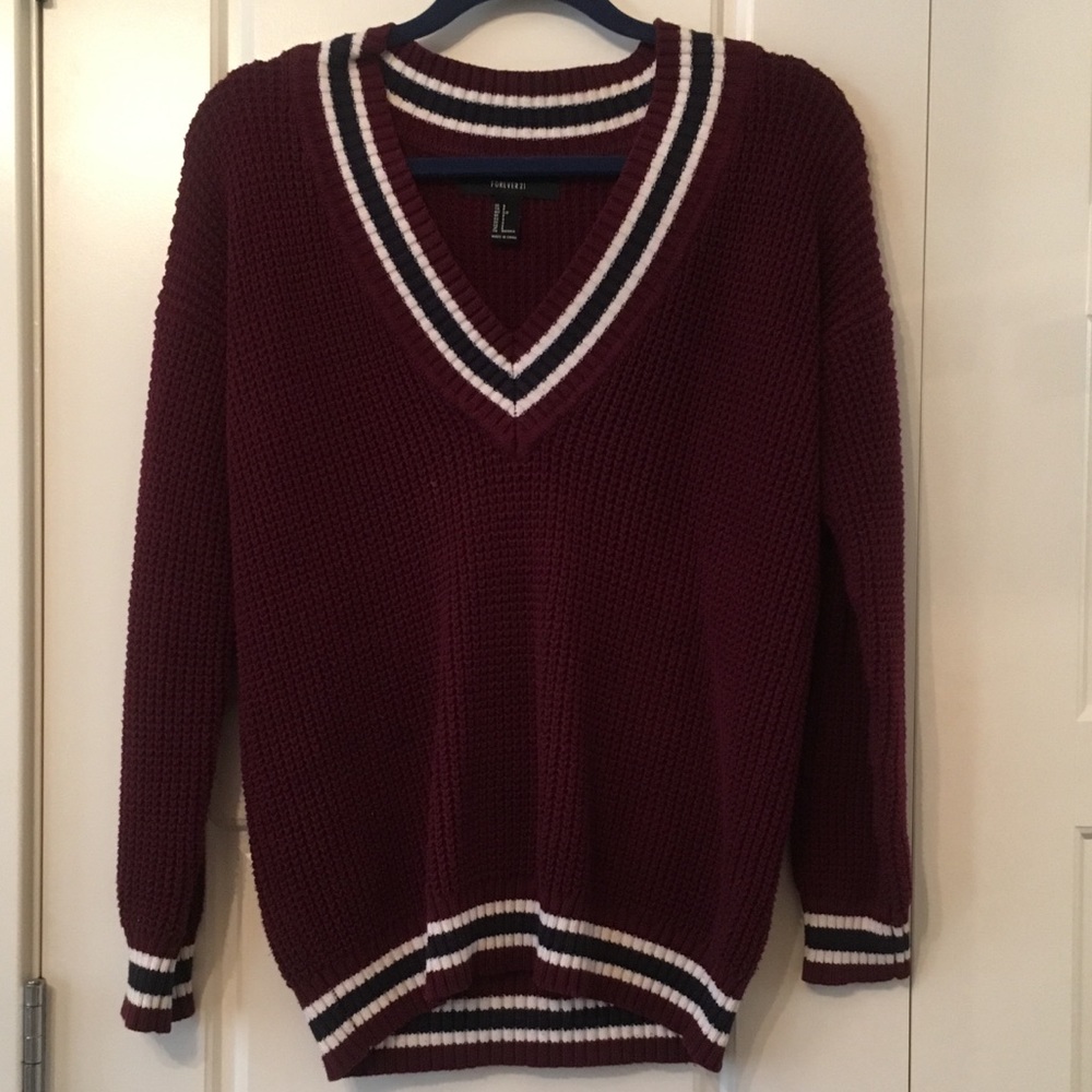 Maroon sweater with stripes.